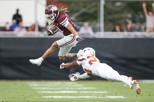 Mississippi State wide receiver Anthony Evans III, top, hurdles Texas defensive back Warren Roberson, bottom, during the first half of an NCAA college football game in Starkville, Miss., Saturday, Oct. 25, 2025. (AP Photo/James Pugh) Mississippi State wide receiver Anthony Evans III, top, hurdles Texas defensive back Warren Roberson, bottom, during the first half of an NCAA college football game in Starkville, Miss., Saturday, Oct. 25, 2025. (AP Photo/James Pugh)