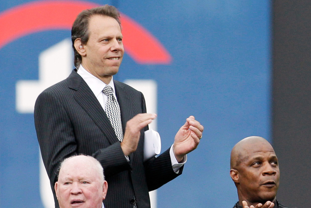 FILE - Mets radio announcer Howie Rose applauds during a Mets Hall of Fame induction ceremony at Citi Field in New York on Aug. 1, 2010. (AP Photo/Kathy Willens, File)