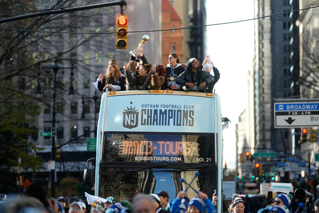 Members of the Gotham Football Club ride down Broadway during a parade celebrating their win over the Washington Spirit for the NWSL championship, Monday, Nov. 24, 2025, in New York. (Michael Appleton/New York City Mayor's Office via AP)