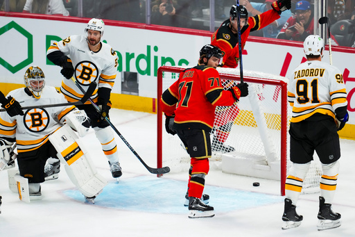 Ottawa Senators' Ridly Greig (71) and Drake Batherson (19) react after a goal by teammate Tim Stützle (not shown) against Boston Bruins goaltender Jeremy Swayman, left, during third-period NHL hockey game action in Ottawa, Ontario, Monday, Oct. 27, 2025. (Sean Kilpatrick/The Canadian Press via AP) Ottawa Senators' Ridly Greig (71) and Drake Batherson (19) react after a goal by teammate Tim Stützle (not shown) against Boston Bruins goaltender Jeremy Swayman, left, during third-period NHL hockey game action in Ottawa, Ontario, Monday, Oct. 27, 2025. (Sean Kilpatrick/The Canadian Press via AP)