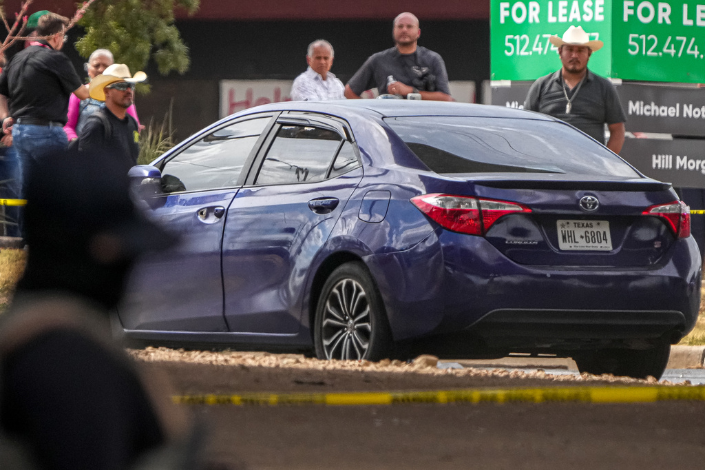 A vehicle is left in the street after a man was shot in his vehicle by an ICE officer, Sunday, Sept. 20, 2026, in Austin, Texas. (Aaron E. Martinez /Austin American-Statesman via AP)