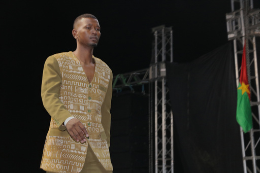 A model walks the runway during a fashion show for peace in Timbuktu, northern Mali, Wednesday, Oct. 22, 2025, (AP Photo/Moulaye Sayah ) A model walks the runway during a fashion show for peace in Timbuktu, northern Mali, Wednesday, Oct. 22, 2025, (AP Photo/Moulaye Sayah )