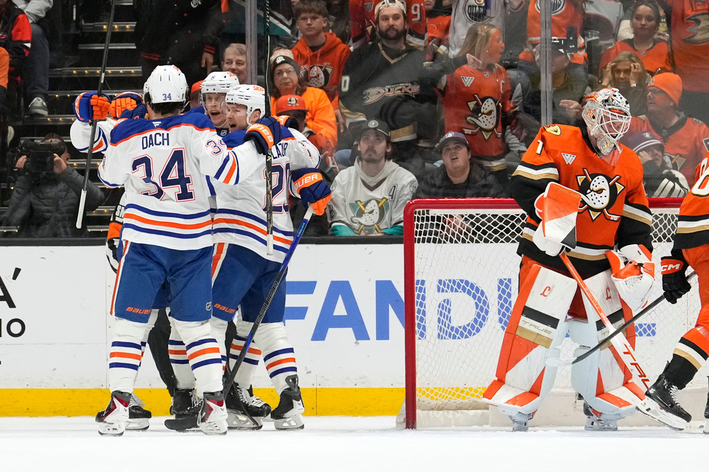 Edmonton Oilers defenseman Connor Murphy, second from left, celebrates his goal with teammates as Anaheim Ducks goaltender Lukas Dostal stands in goal during the first period of Game 6 in the first round of the NHL hockey Stanley Cup playoffs series Thursday, April 30, 2026, in Anaheim, Calif. (AP Photo/Mark J. Terrill)
