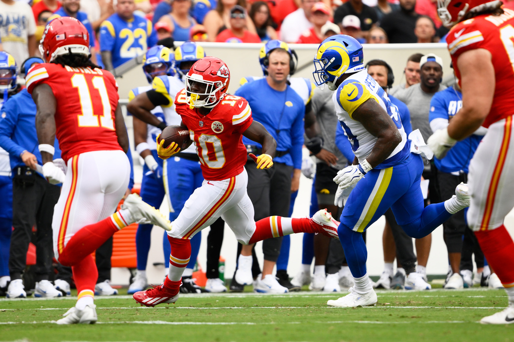 Kansas City Chiefs running back Emmett Johnson runs against the Los Angeles Rams during the first half of an NFL preseason football game, Saturday, Aug. 15, 2026, in Kansas City, MO. (AP Photo/Reed Hoffmann)