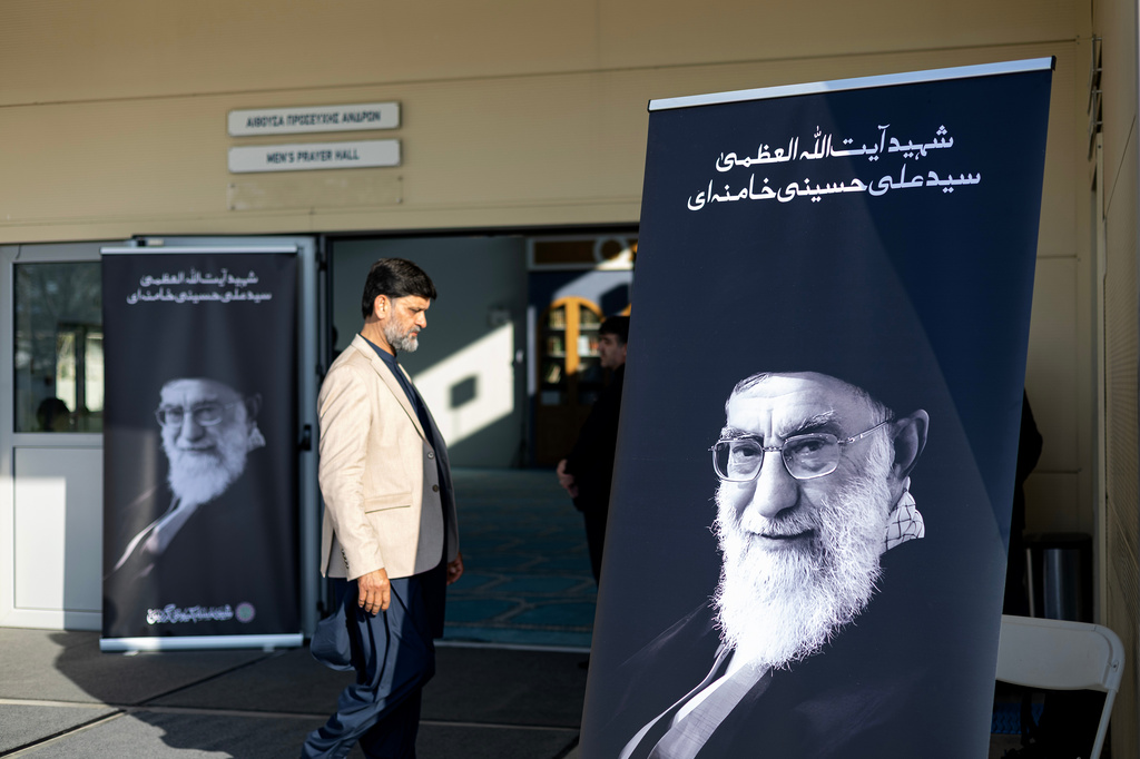 A muslim walks outside a mosque where a commemorative religious event in honor of late Supreme Leader Ayatollah Ali Khamenei is taking place, organized by the Shiite Muslim Community of Greece in Athens, on Sunday, April 19, 2026. (AP Photo/Yorgos Karahalis)