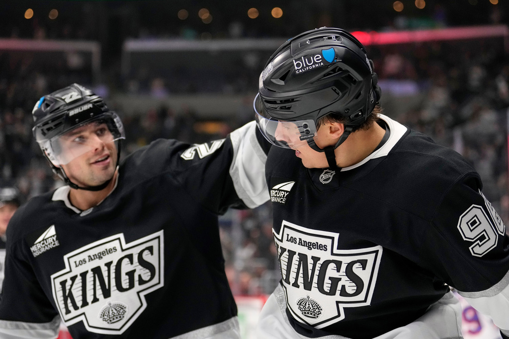 Los Angeles Kings left wing Andrei Kuzmenko, right, is congratulated by left wing Kevin Fiala after scoring during the second period of an NHL hockey game against the New York Rangers, Tuesday, Jan. 20, 2026, in Los Angeles. (AP Photo/Mark J. Terrill)