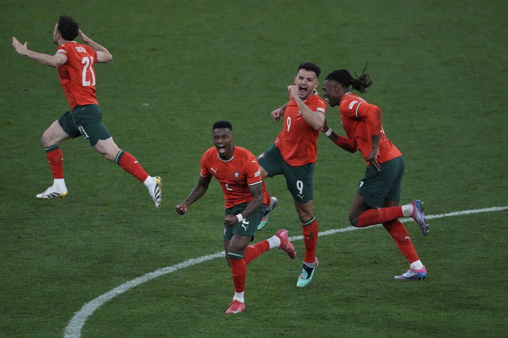 Portugal's players celebrate after winning the Nations League final soccer match between Portugal and Spain at the Allianz Arena in Munich, Germany, Sunday, June 8, 2025. (AP Photo/Michael Probst)