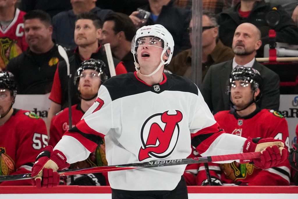 New Jersey Devils defenseman Simon Nemec (17) watches the replay after scoring on the Chicago Blackhawks during the second period of an NHL hockey game Wednesday, Nov. 12, 2025, in Chicago. (AP Photo/Erin Hooley)