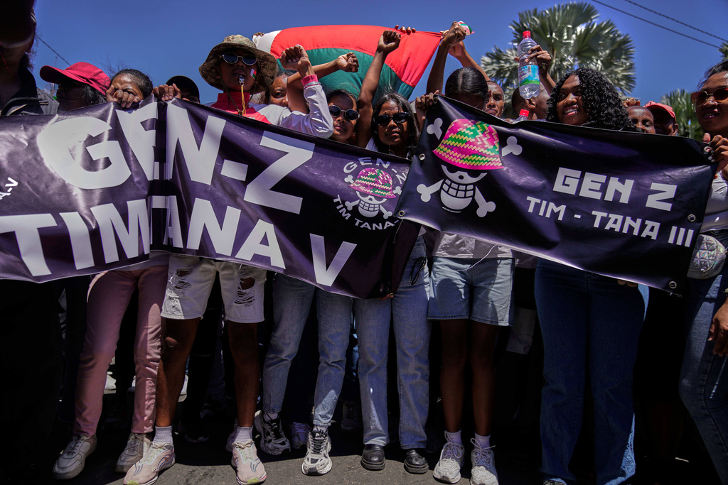 Protesters call for President Andry Rajoelina to step down in Antananarivo, Madagascar, Tuesday, Oct. 14, 2025. (AP Photo/Brian Inganga)
