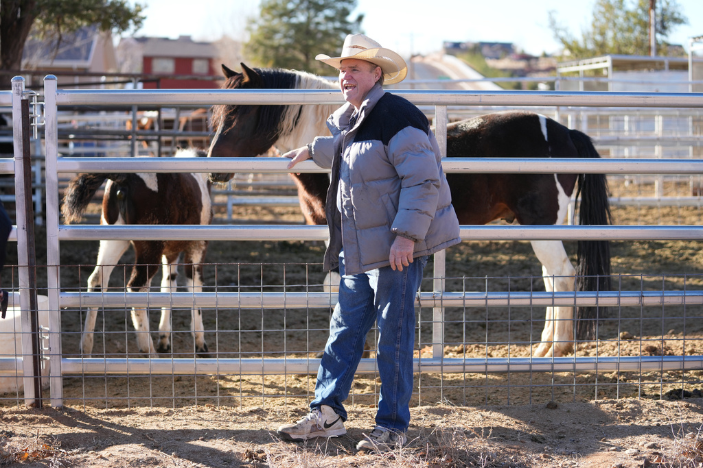 Isaac Wyler, a former member of The Fundamentalist Church of Jesus Christ of Latter-Day Saints (FLDS), poses with his horse Friday, Dec. 5, 2025, in Hildale, Utah. (AP Photo/Rick Bowmer)