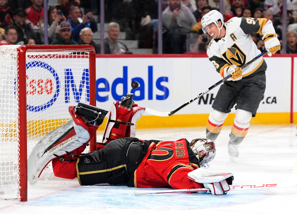 The penalty shot of Vegas Golden Knights' Mitch Marner (93) goes wide of the net of Ottawa Senators goaltender Mads Sogaard (40) during the first period of an NHL hockey game in Ottawa, on Sunday, Jan. 25, 2026. (Justin Tang/The Canadian Press via AP)