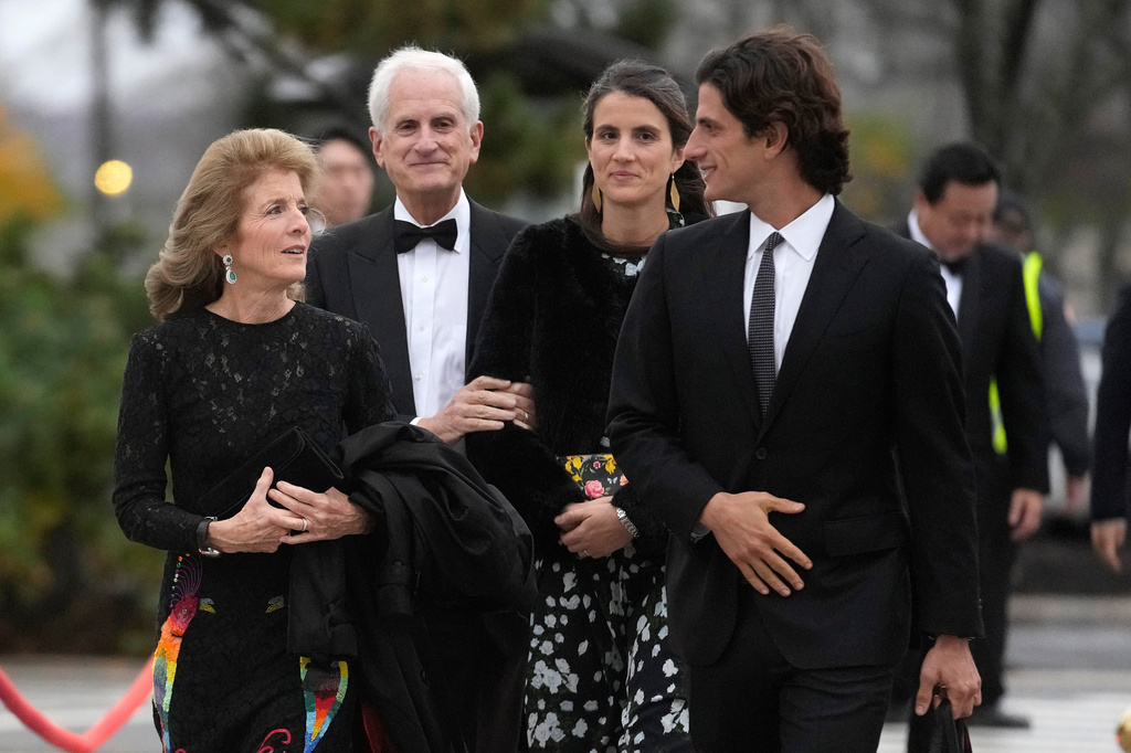 FILE - Caroline Kennedy, ambassador of the United States to Australia, left, arrives with her husband, Edwin Schlossberg, center left, and her children, Tatiana Schlossberg, center right, and Jack Schlossberg, right, Oct. 29, 2023, before the presentation ceremony for the John F. Kennedy Profile in Courage Award at the John F. Kennedy Presidential Library and Museum, in Boston. (AP Photo/Steven Senne, File)