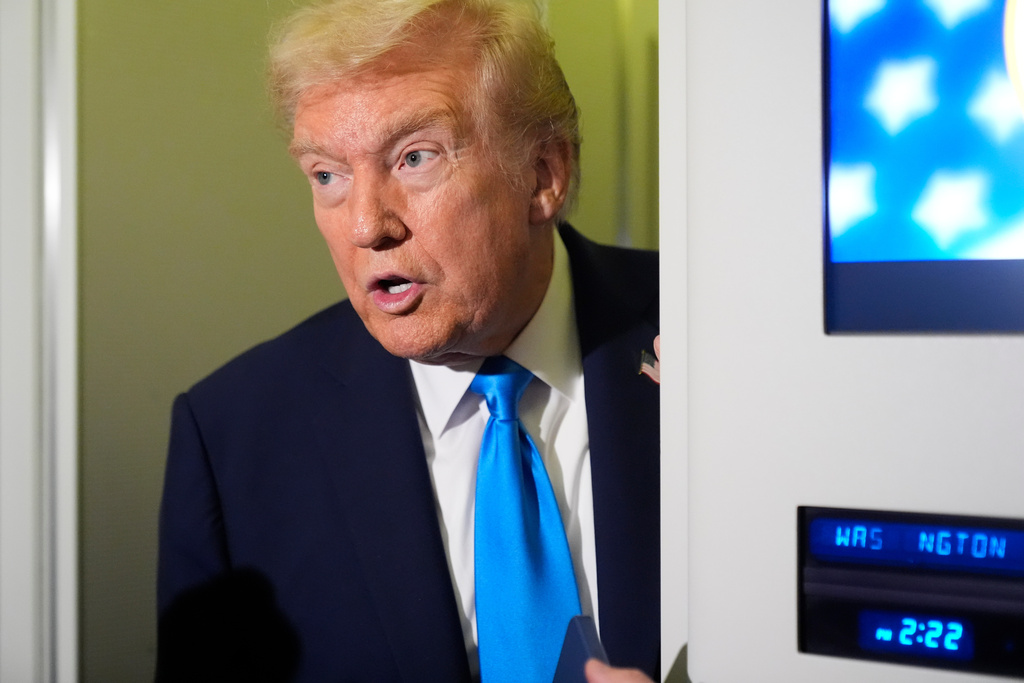 FILE - President Donald Trump speaks with reporters aboard Air Force One at Al Udeid Air Base in Doha, Qatar, Oct. 25, 2025. (AP Photo/Mark Schiefelbein, File)