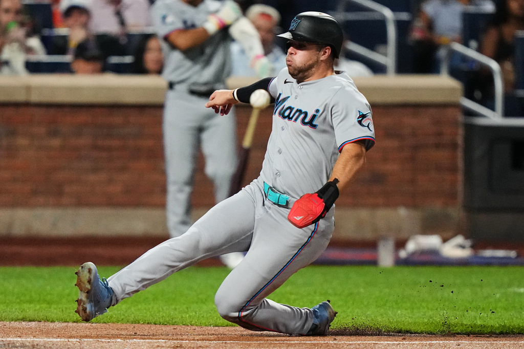 Miami Marlins' Jakob Marsee scores on a single by Joe Mack during the fifth inning of a baseball game against the New York Mets Friday, July 31, 2026, in New York. (AP Photo/Frank Franklin II)