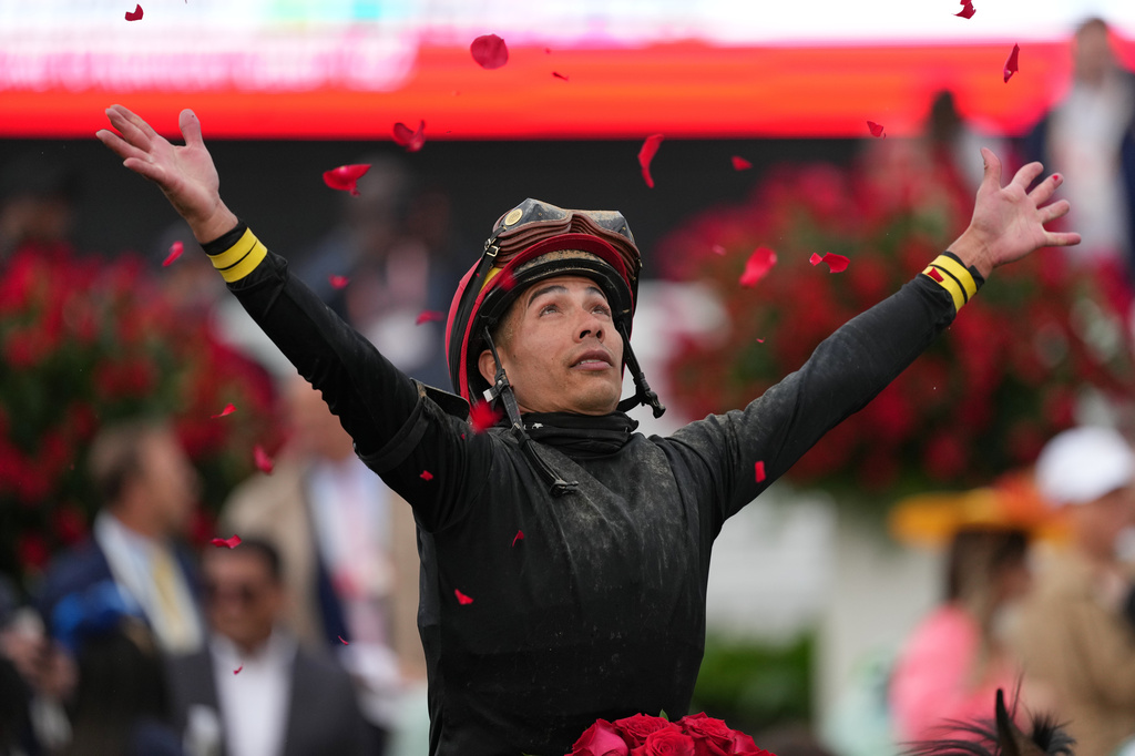 Jockey Jose L. Ortiz celebrates after riding Golden Tempo to victory in the 152nd running of the Kentucky Derby horse race at Churchill Downs, Saturday, May 2, 2026, in Louisville, Ky. (AP Photo/Abbie Parr)