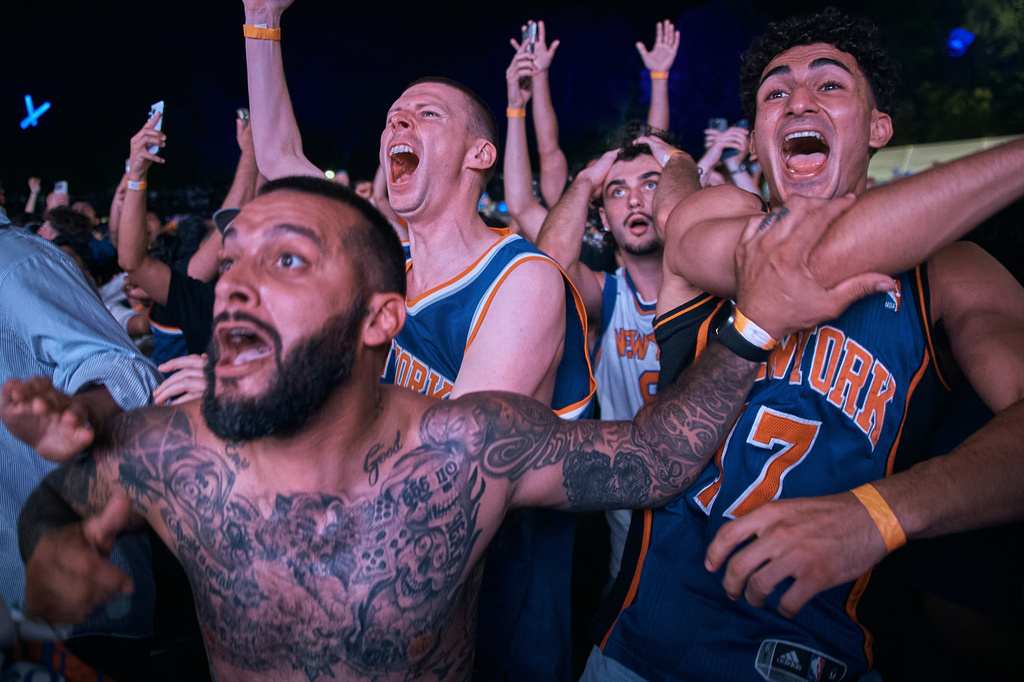 New York Knicks fans celebrate their victory after a watch party for Game 5 of the NBA Finals basketball series against the San Antonio Spurs, Saturday, June 13, 2026, in New York. (AP Photo/Andres Kudacki)