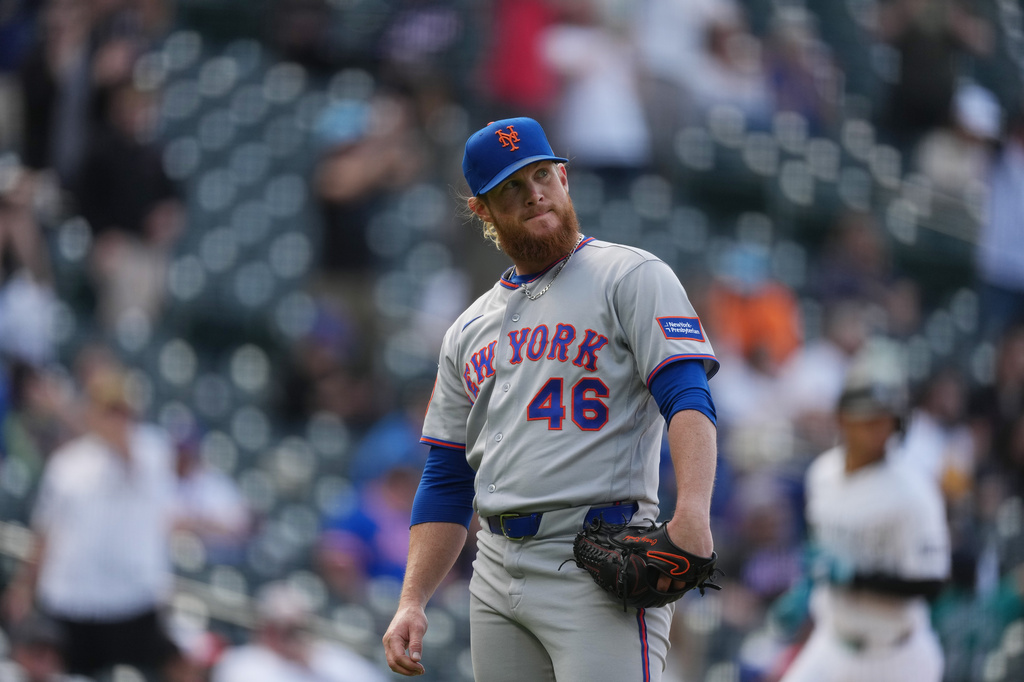 New York Mets relief pitcher Craig Kimbrel reacts after giving up a grand slam to Colorado Rockies' Jake McCarthy in the eighth inning of a baseball game, Thursday, May 7, 2026, in Denver. (AP Photo/David Zalubowski)