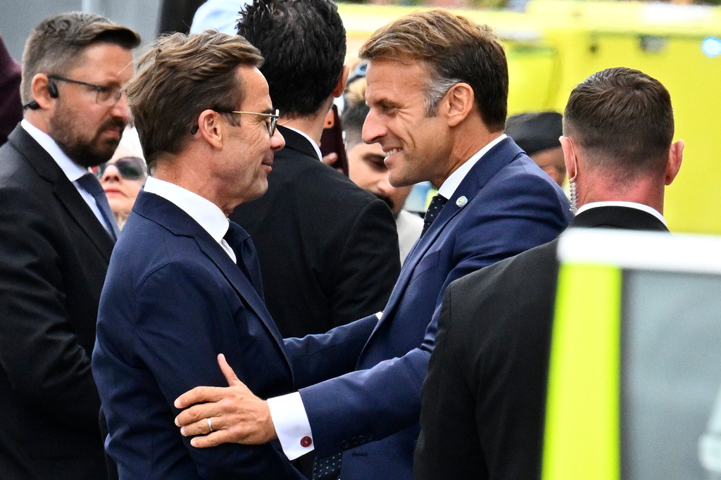 French President Emmanuel Macron, right, is welcomed by Swedish Prime Minister Ulf Kristersson, in Stockholm, Sweden, Monday, Aug. 31, 2026. (Anders Wiklund /TT News Agency via AP)
