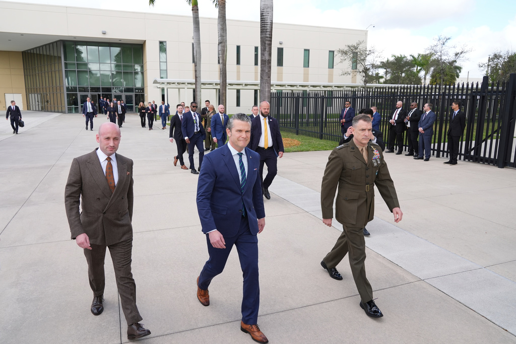 From left, White House deputy chief of staff Stephen Miller, Defense Secretary Pete Hegseth and Gen. Francis L. Donovan, Commander of the Southern Command, arrive at the inaugural Americas Counter Cartel Conference at U.S. Southern Command in Doral, Fla., Thursday, March 5, 2026. (AP Photo/Rebecca Blackwell)