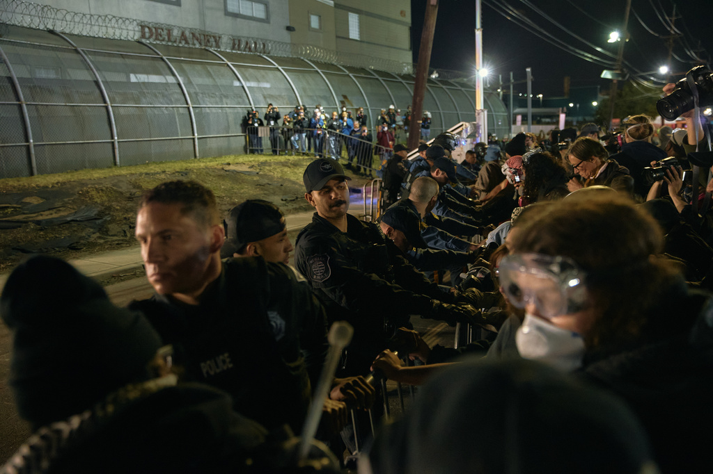 FILE - Police try to hold the line as protesters push the fences outside the Delaney Hall detention center during a protest against the transfer of detainees and federal immigration policies, May 30, 2026, in Newark, N.J. (AP Photo/Andres Kudacki, File)