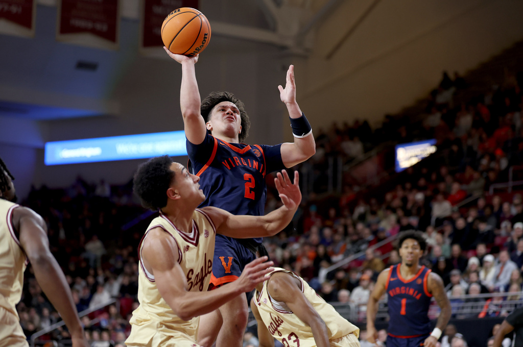 Virginia guard Chance Mallory (2) scores during the first half of an NCAA college basketball game against Boston College, Saturday, Jan. 31, 2026, in Boston. (AP Photo/Mark Stockwell)