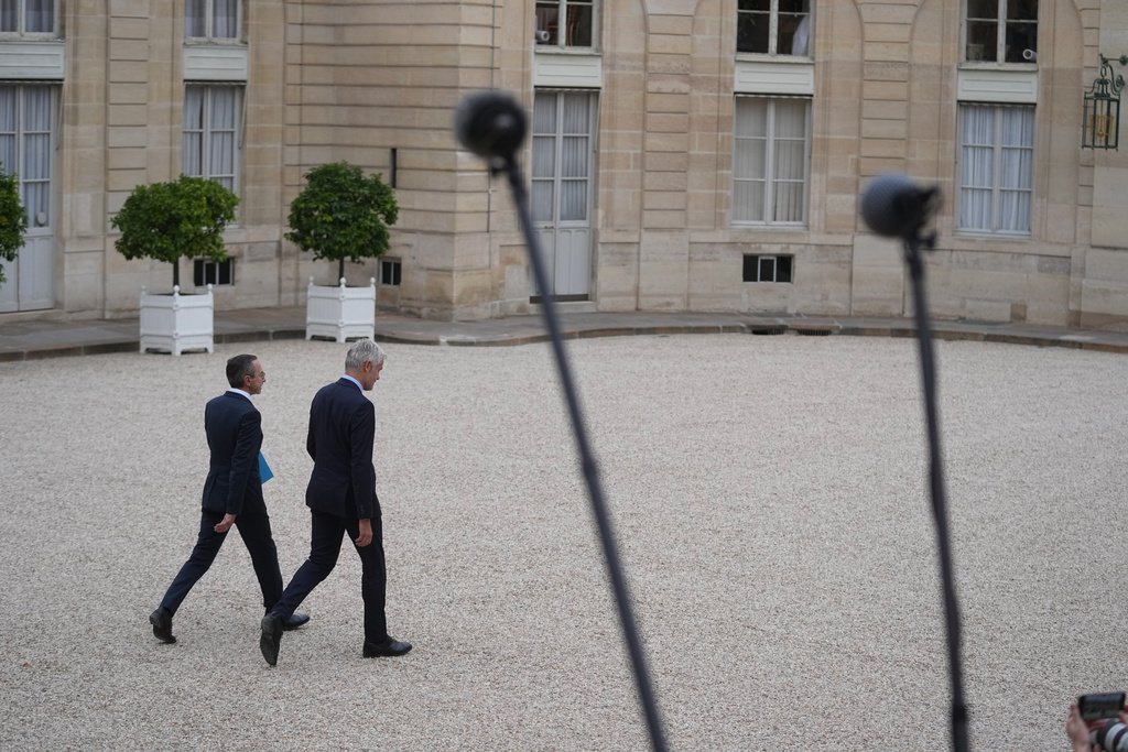 Head of Les Republicains political party Laurent Wauquiez, left, and Bruno Retailleau, head of the Conservative Party Les Republicains and outgoing Interior Minister leave after a meeting with French president Emmanuel Macron at the Elysee Palace, in Paris, Friday, Oct. 10, 2025. (AP Photo/Thibault Camus)