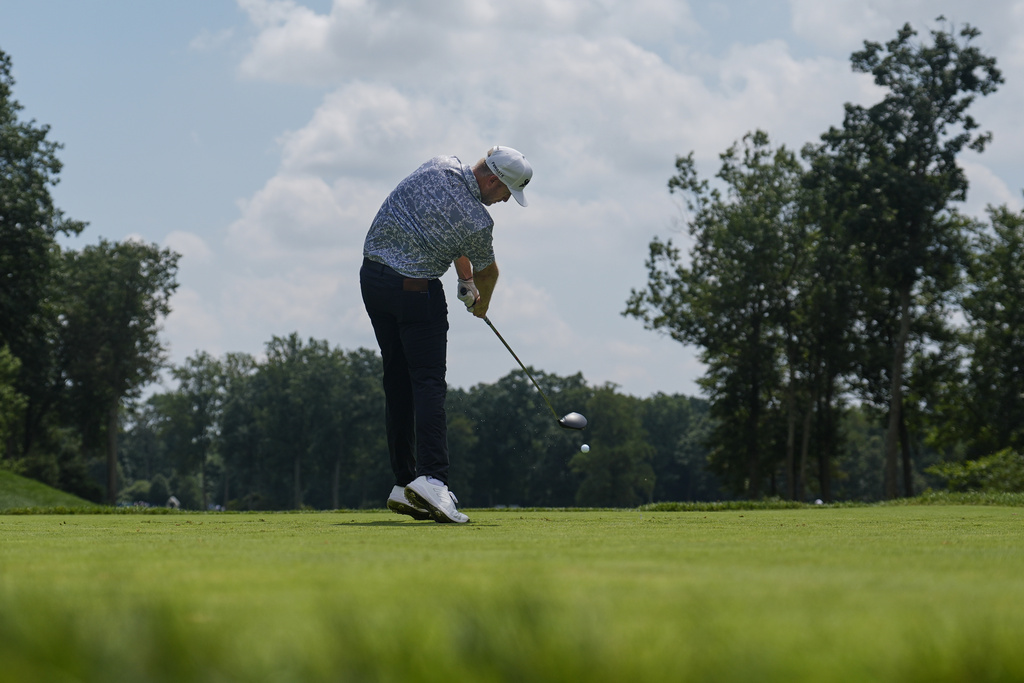 Taylor Pendrith, of Canada, hits from the fourth tee during the third round of the BMW Championship golf tournament Saturday, Aug. 16, 2025, in Owings Mills, Md. (AP Photo/Stephanie Scarbrough)
