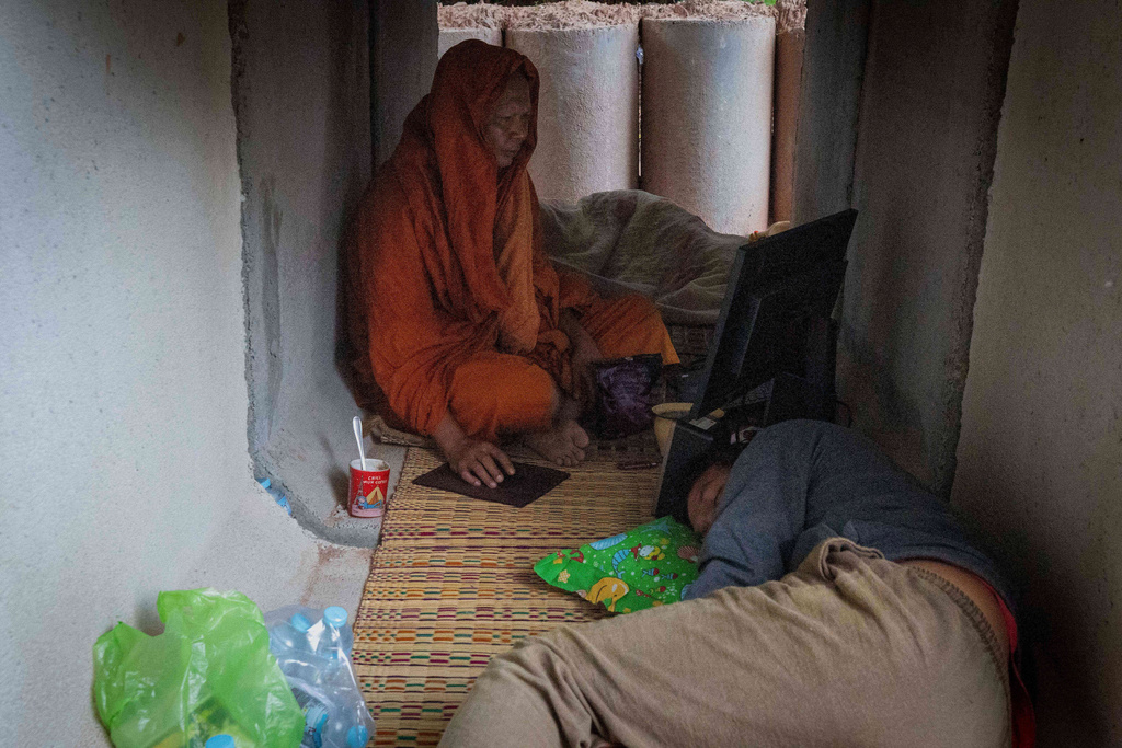 Thai residents, who fled clashes between Thai and Cambodian soldiers, take shelter in Buriram province, Thailand, Tuesday, Dec. 9, 2025. (AP Photo/Wason Wanichakorn)