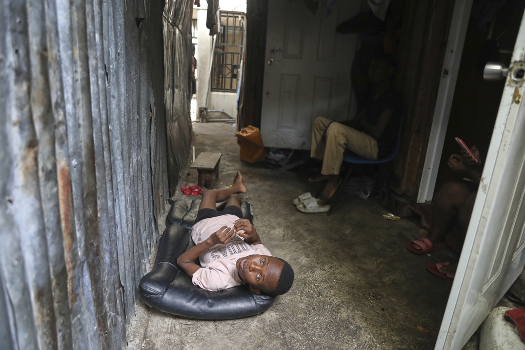 People displaced by gang violence live at the Ministry of Public Works, Transport and Communications office converted into a shelter in Port-au-Prince, Haiti, Tuesday, Sept. 9, 2025. (AP Photo/Odelyn Joseph)