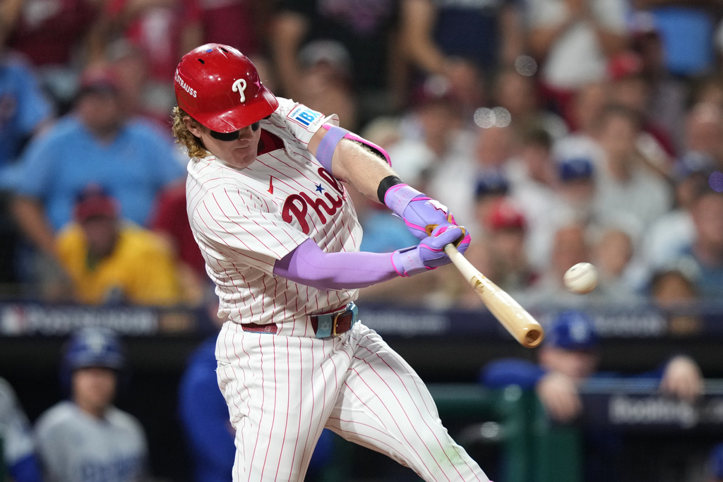 Philadelphia Phillies' Harrison Bader hits an RBI-sacrifice fly against Los Angeles Dodgers pitcher Shohei Ohtani during the second inning in Game 1 of baseball's National League Division Series, Saturday, Oct. 4, 2025, in Philadelphia. (AP Photo/Matt Slocum)