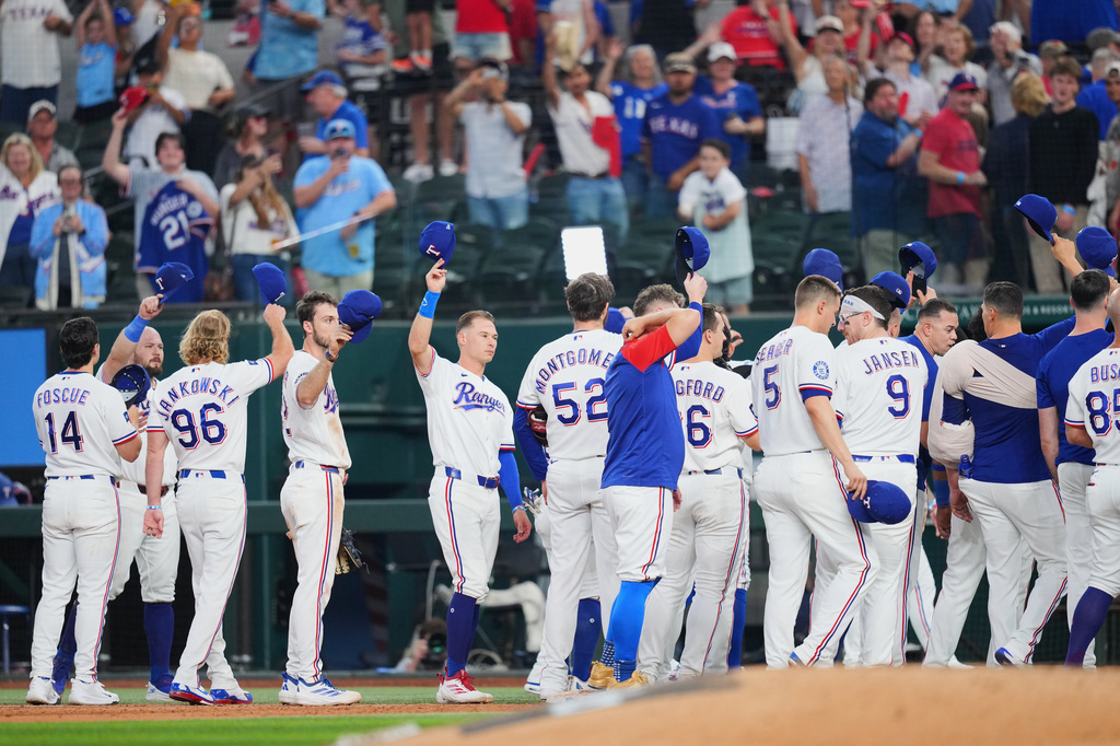 Texas Rangers players gesture following a baseball game against the New York Mets, Thursday, Sept. 24, 2026, in Arlington, Texas. (AP Photo/Julio Cortez)