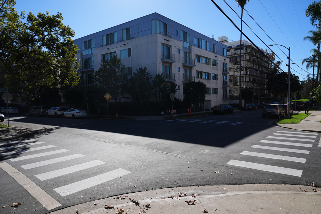 Crosswalks painted by activists are shown at the intersection of Wilkins Ave. and Kelton Ave. in the Westwood section of Los Angeles Tuesday, Dec. 9, 2025, in Los Angeles. (AP Photo/Marcio Jose Sanchez)