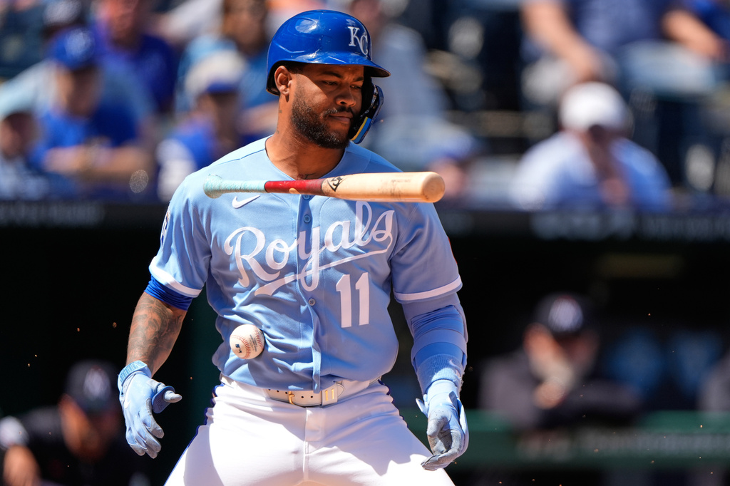 Kansas City Royals' Maikel Garcia is hit by a ball that bounced off the catcher during the third inning of a baseball game against the Minnesota Twins, Thursday, April 2, 2026, in Kansas City, Mo. (AP Photo/Charlie Riedel)