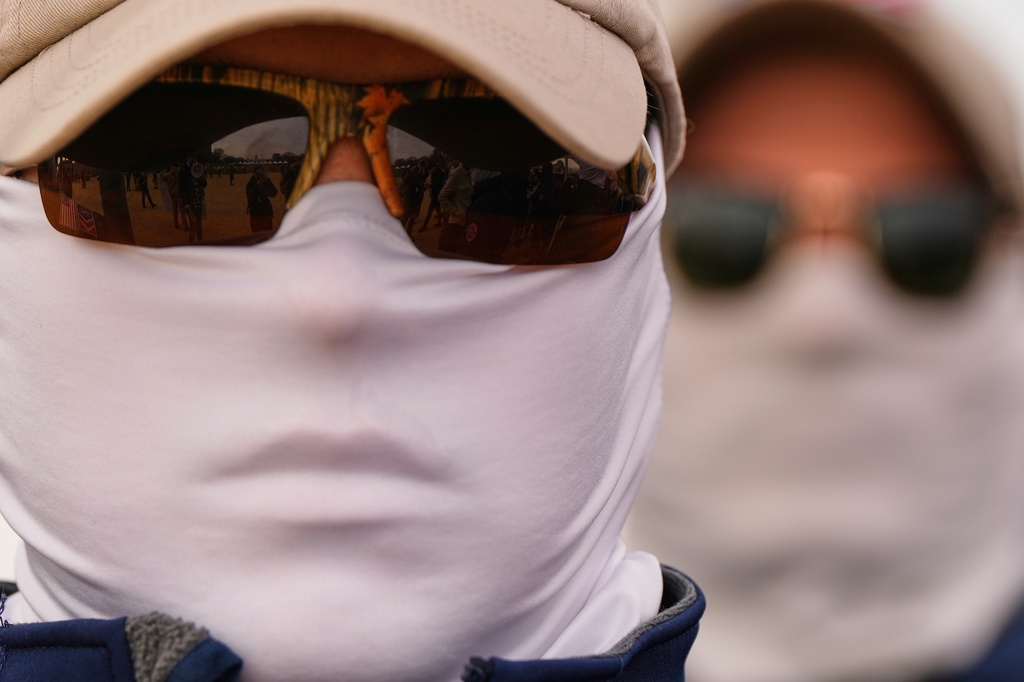 A member of the Patriot Front wears a face covering on the National Mall during the annual March for Life, Friday, Jan. 23, 2026, in Washington. (AP Photo/Julia Demaree Nikhinson)