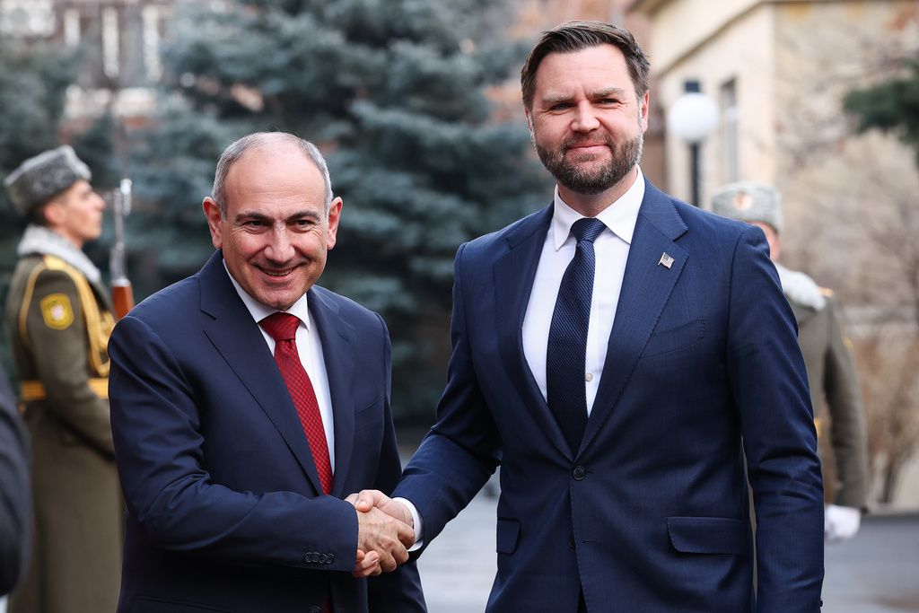 Armenia's Prime Minister Nikol Pashinyan shakes hands with Vice President JD Vance, at the President's Residence, in Yerevan, Armenia, Monday, Feb. 9, 2026. (Kevin Lamarque/Pool Photo via AP)