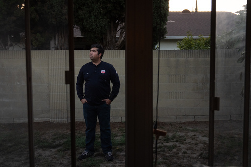 Wilfredo Cruz, an oil worker at the Phillips 66 Los Angeles Refinery Wilmington Plant, stands for a photo in the backyard of his home in Cerritos, Calif., Tuesday, Sept. 30, 2025. (AP Photo/Jae C. Hong) Wilfredo Cruz, an oil worker at the Phillips 66 Los Angeles Refinery Wilmington Plant, stands for a photo in the backyard of his home in Cerritos, Calif., Tuesday, Sept. 30, 2025. (AP Photo/Jae C. Hong)