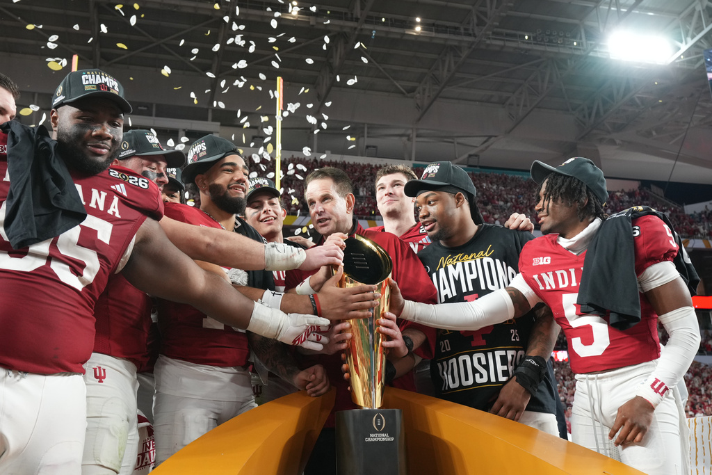 Indiana head coach Curt Cignetti holds the trophy after their win against Miami in the College Football Playoff national championship game, Monday, Jan. 19, 2026, in Miami Gardens, Fla. (AP Photo/Rebecca Blackwell)