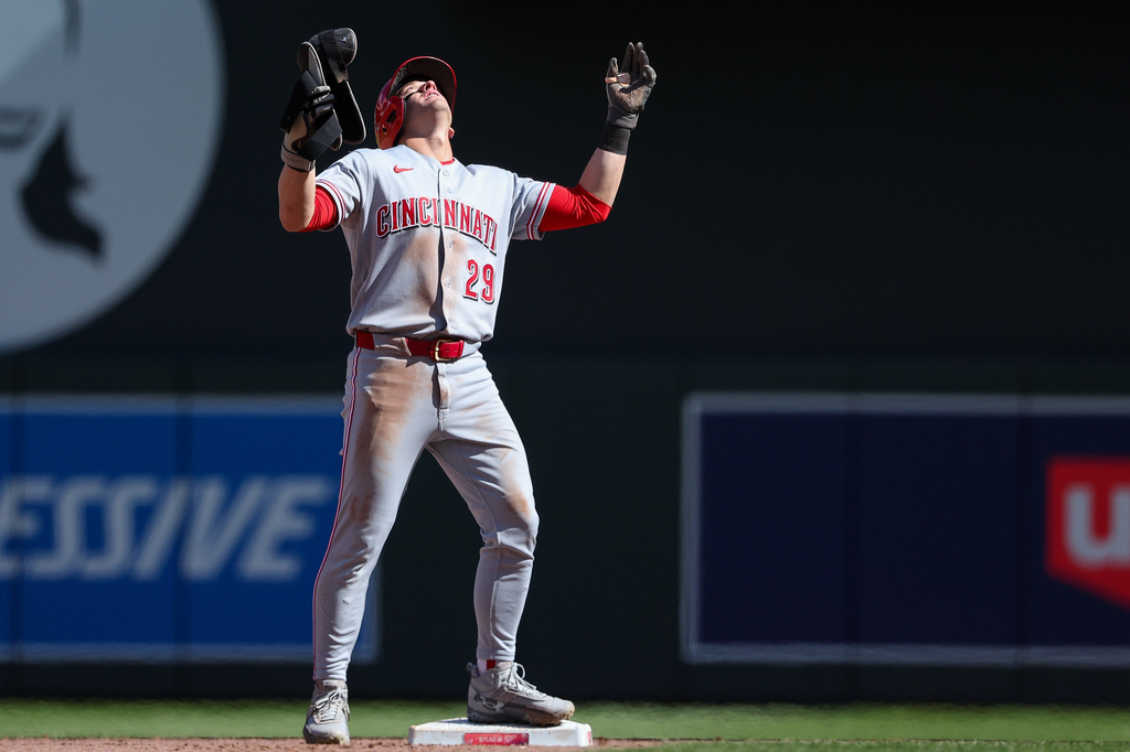 Cincinnati Reds' TJ Friedl celebrates after his RBI double against the Minnesota Twins during the ninth inning of baseball game, Sunday, April 19, 2026, in Minneapolis. (AP Photo/Matt Krohn)