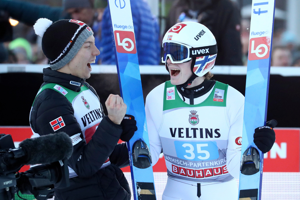 FILE - Johann Andre Forfang, left, and Marius Lindvik, both of Norway, celebrate after the final round at the second stage of the 68th four hills ski jumping tournament in Garmisch-Partenkirchen, Germany, Jan. 1, 2020. (AP Photo/Matthias Schrader, File)