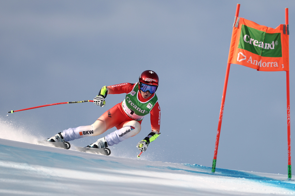 Switzerland's Corinne Suter speeds down the course during a women's World Cup super-G race, in Soldeu, Andorra, Saturday, Feb. 28, 2026. (AP Photo/Gabriele Facciotti)