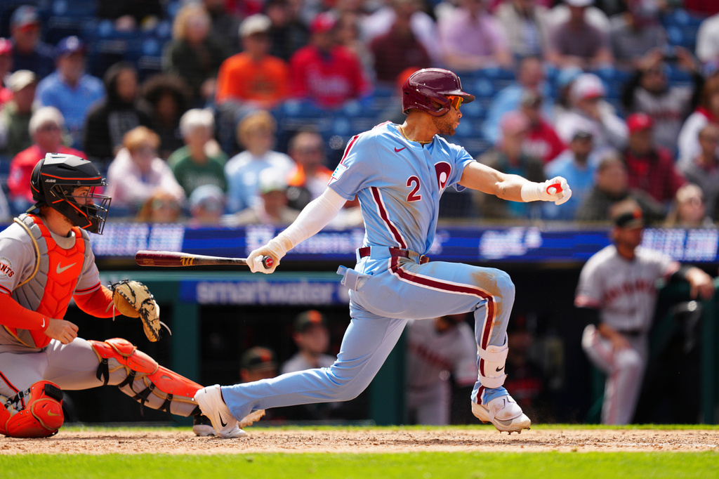 Philadelphia Phillies' Justin Crawford hits a walk off RBI single to drive in the game-winning run in the ninth inning of the first baseball game of a doubleheader against the San Francisco Giants, Thursday, April 30, 2026, in Philadelphia. (AP Photo/Derik Hamilton)