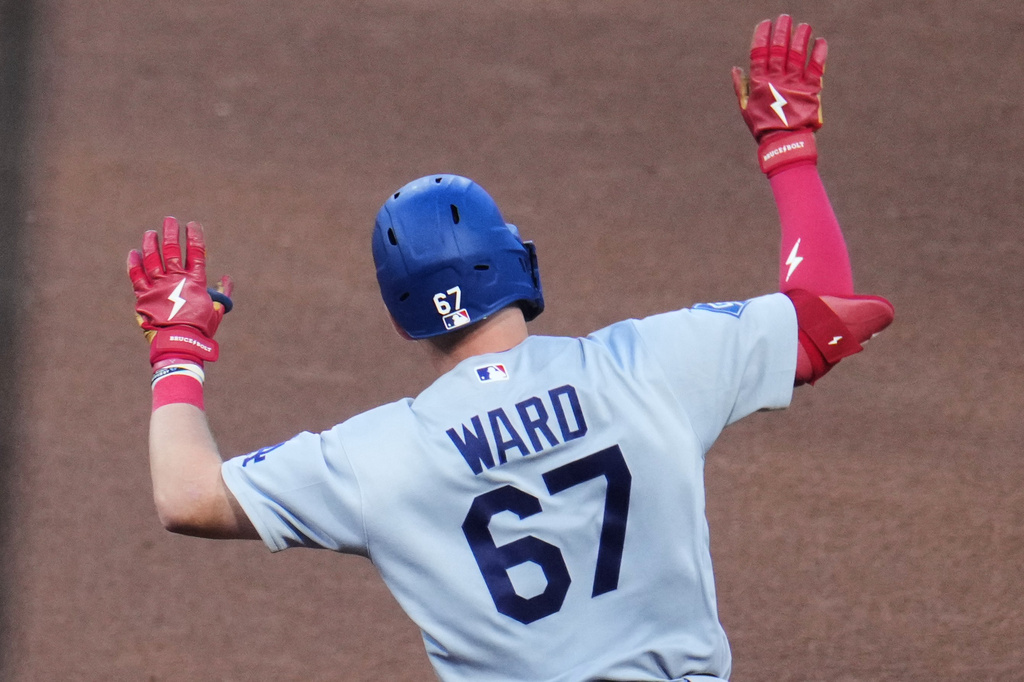 Los Angeles Dodgers' Ryan Ward celebrates as he rounds the bases after hitting a grand slam home run off Pittsburgh Pirates pitcher Carmen Mlodzinski during the sixth inning of a baseball game in Pittsburgh, Wednesday, June 10, 2026. (AP Photo/Gene J. Puskar)