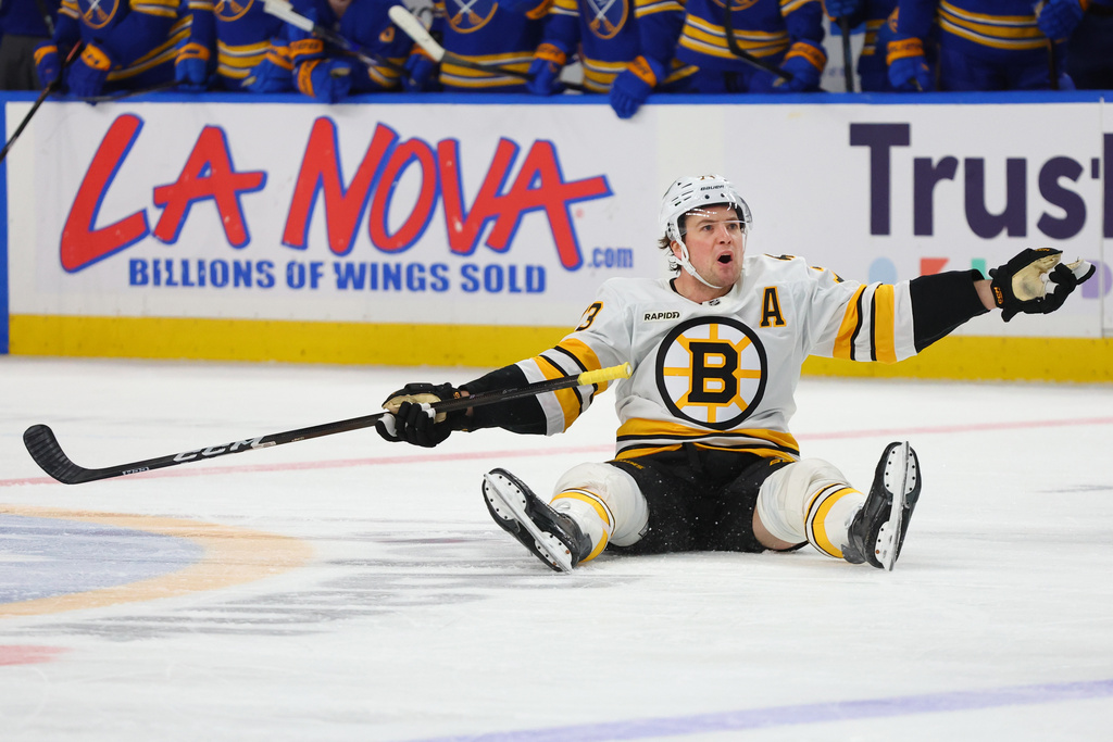 Boston Bruins defenseman Charlie McAvoy (73) reacts after being brought down during the second period of an NHL hockey game against the Buffalo Sabres Wednesday, March 25, 2026, in Buffalo, N.Y. (AP Photo/Jeffrey T. Barnes)