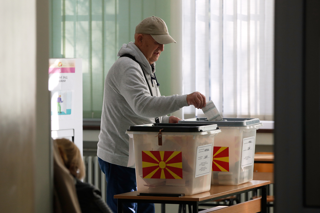 A man casts his ballot in the runoff local elections, at a polling station in Skopje, North Macedonia, on Sunday, Nov. 2, 2025. (AP Photo/Boris Grdanoski)