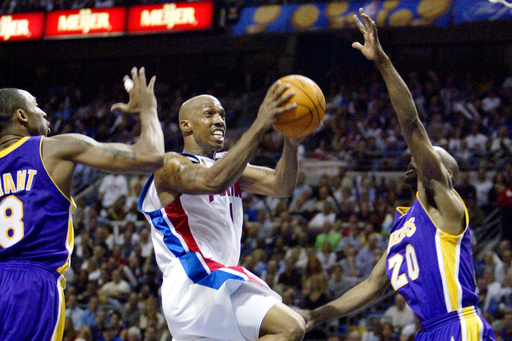 FILE - Detroit Pistons Chauncey Billups (1) goes to the basket between Los Angeles Lakers Kobe Bryant (8) and Gary Payton (20) in the first half of Game 3 of the NBA finals at the Palace in Auburn Hills, Mich., June 10, 2004. (AP Photo/Michael Conroy, File) FILE - Detroit Pistons Chauncey Billups (1) goes to the basket between Los Angeles Lakers Kobe Bryant (8) and Gary Payton (20) in the first half of Game 3 of the NBA finals at the Palace in Auburn Hills, Mich., June 10, 2004. (AP Photo/Michael Conroy, File)