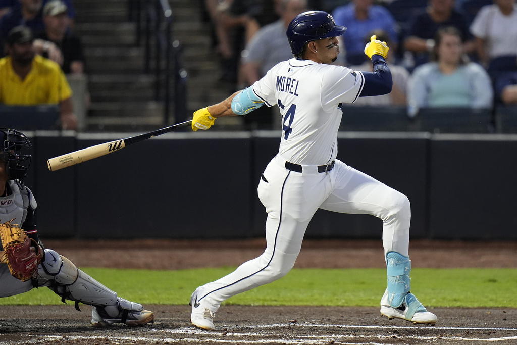 Tampa Bay Rays' Christopher Morel follows his RBI single off Cleveland Guardians pitcher Logan Allen during the first inning of a baseball game Thursday, Sept. 4, 2025, in Tampa, Fla. (AP Photo/Chris O'Meara)