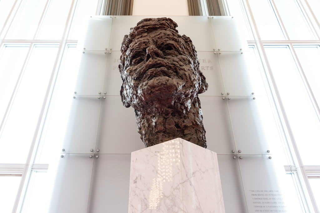 An eight foot tall bronze bust of President John F. Kennedy is seen in the Grand Foyer of the John F. Kennedy Center for the Performing Arts during a media tour to show building damage, Wednesday, April 22, 2026, in Washington. (AP Photo/Julia Demaree Nikhinson)