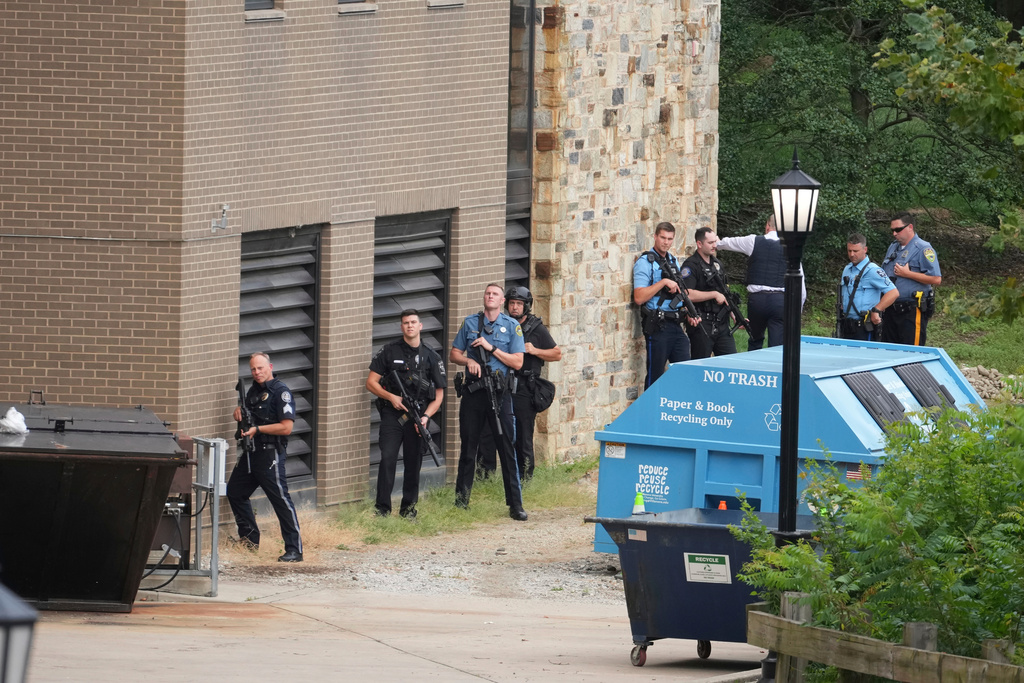 Police gather at the Villanova University campus where an active shooter was reported Thursday, Aug. 21, 2025, in Villanova, Pa. (AP Photo/Matt Slocum)