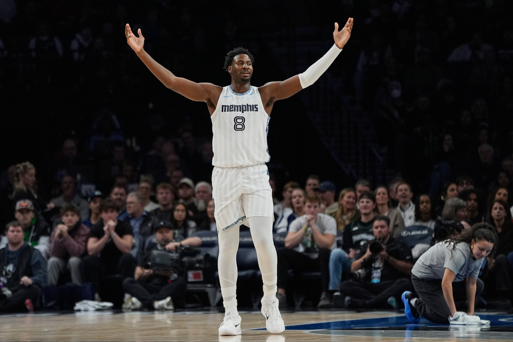 Memphis Grizzlies forward Jaren Jackson Jr. (8) looks toward a referee during the first half of an NBA basketball game against the Minnesota Timberwolves, Wednesday, Dec. 17, 2025, in Minneapolis. (AP Photo/Abbie Parr)