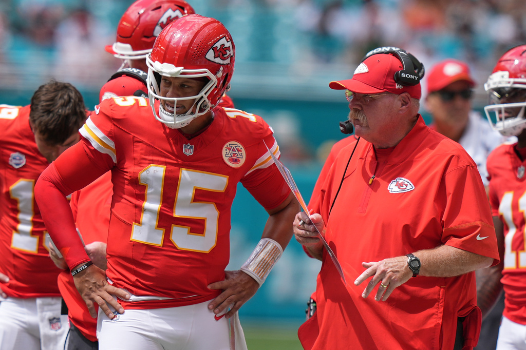 Kansas City Chiefs quarterback Patrick Mahomes (15) talks with Kansas City Chiefs head coach Andy Reid during an NFL football game against the Miami Dolphins, Sunday, Sept. 27, 2026, in Miami Gardens. (AP Photo/Lynne Sladky)